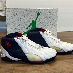 White and navy Jordan cover 3 shoes